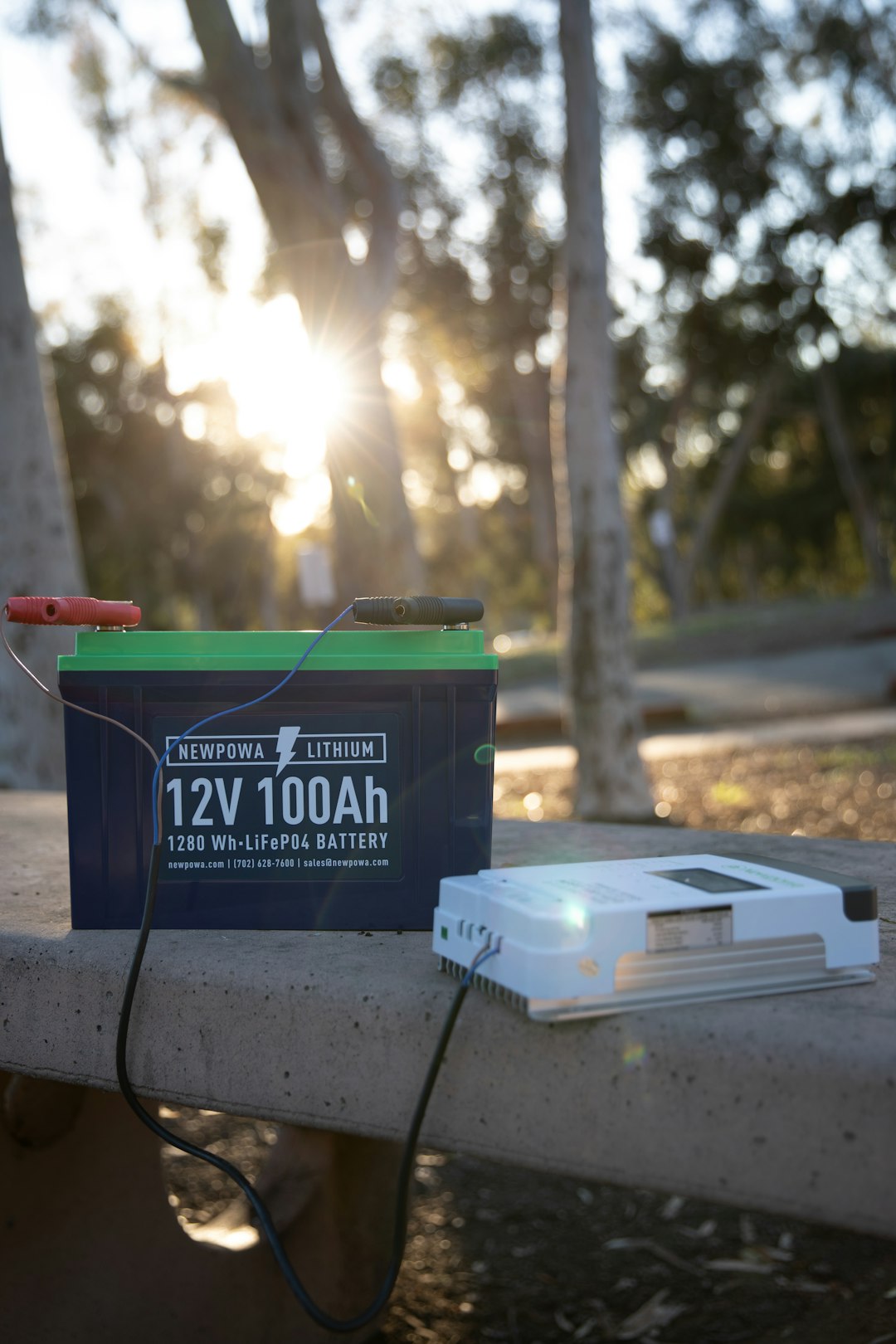 a-battery-and-a-charger-sitting-on-a-ledge-lmbrmxxqv-i