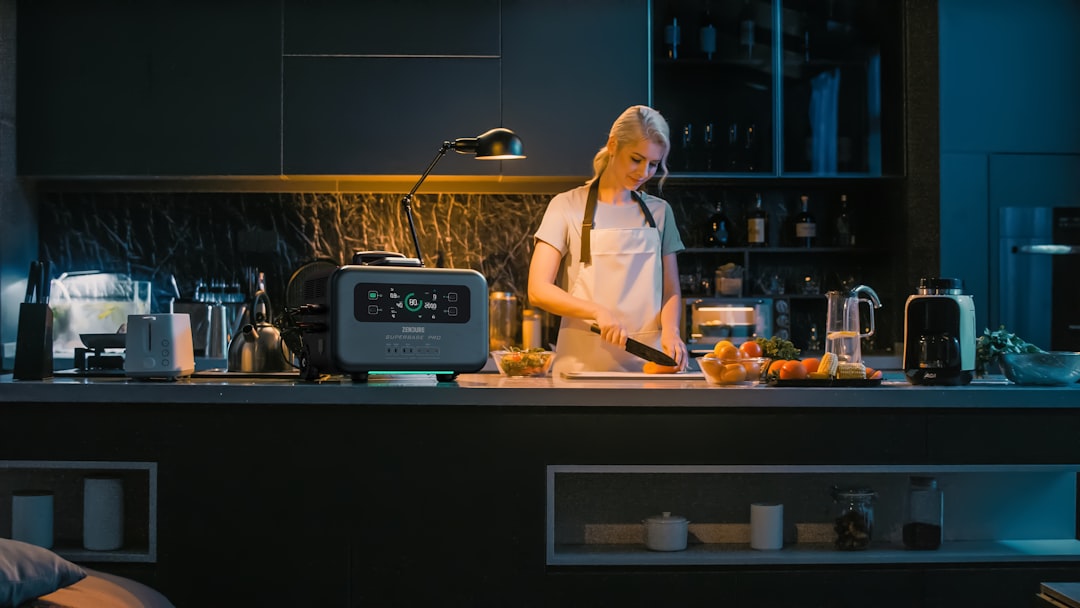 a-woman-standing-in-a-kitchen-preparing-food-uy1etjau384